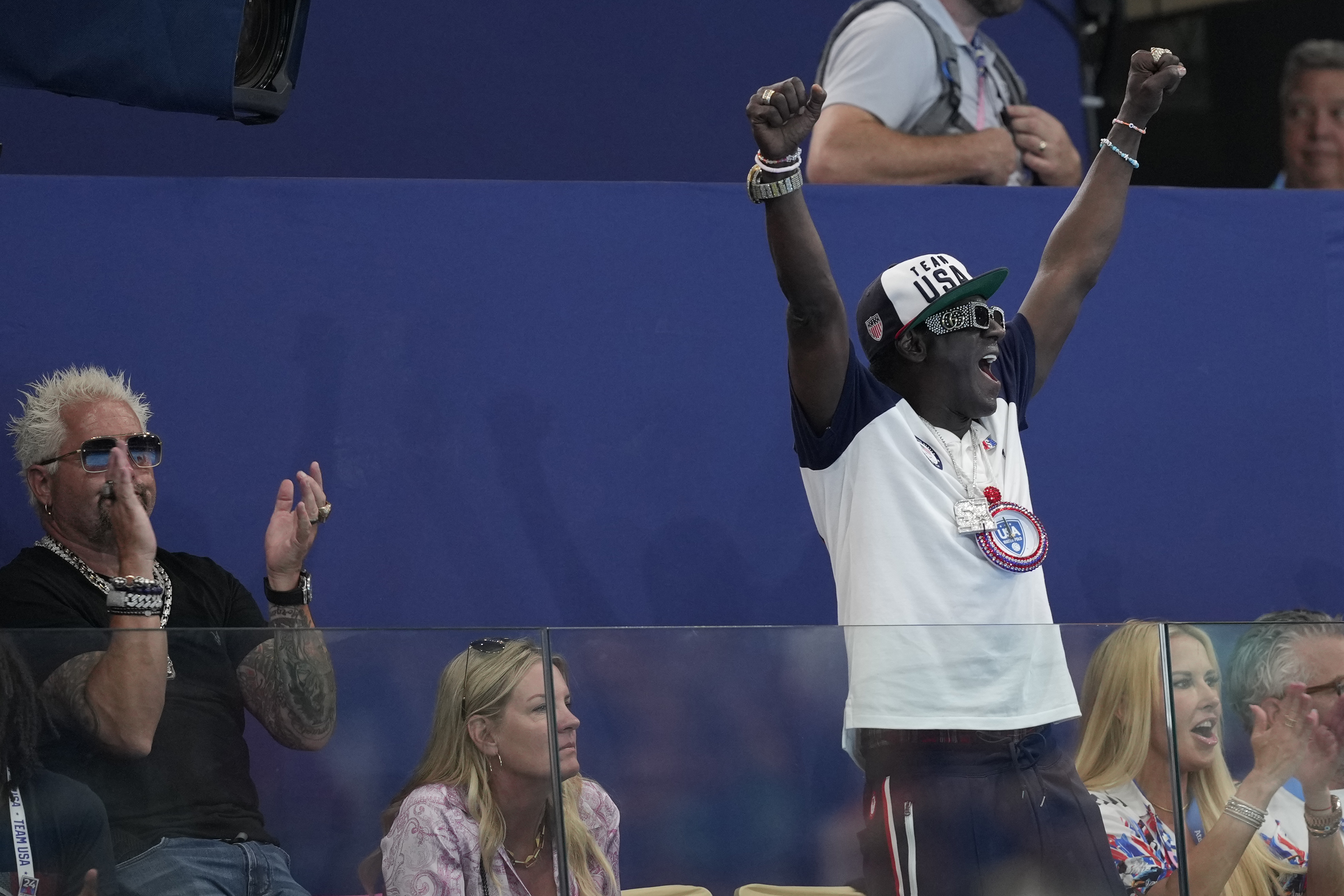 Flavor Flav sported U.S. national team attire as he cheered from the stands