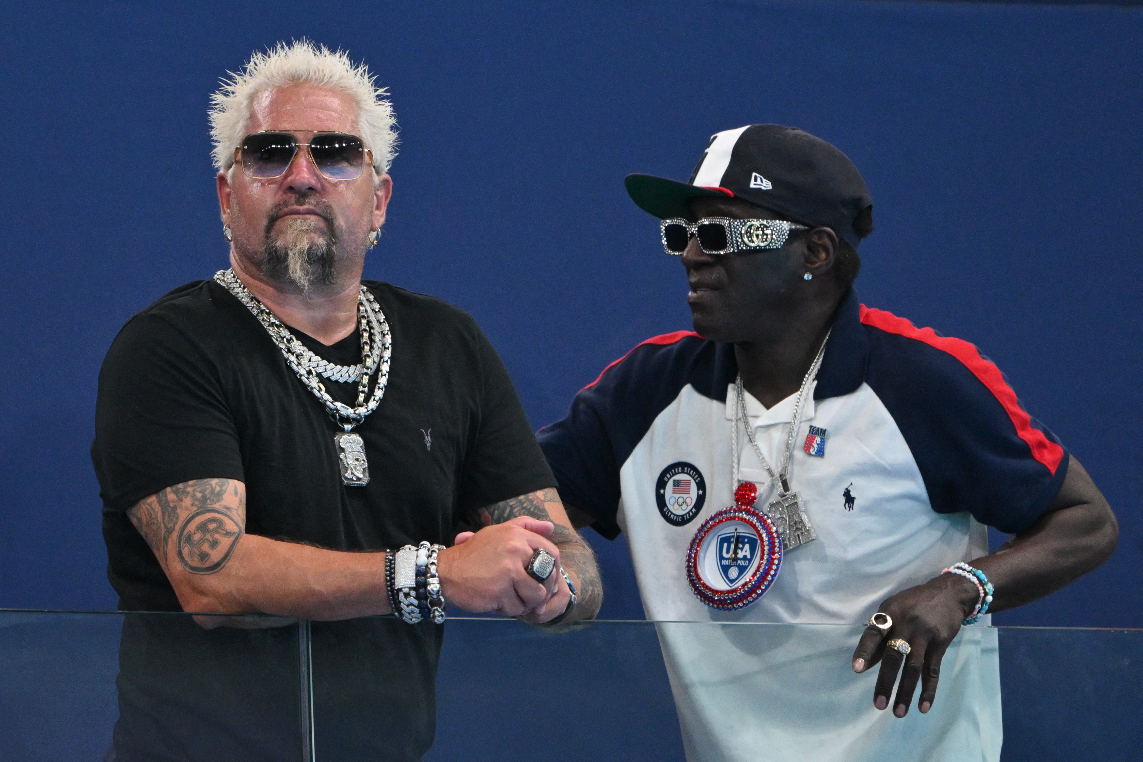 Guy Fieri flaunted his thinner frame in a form-fitting black T-shirt