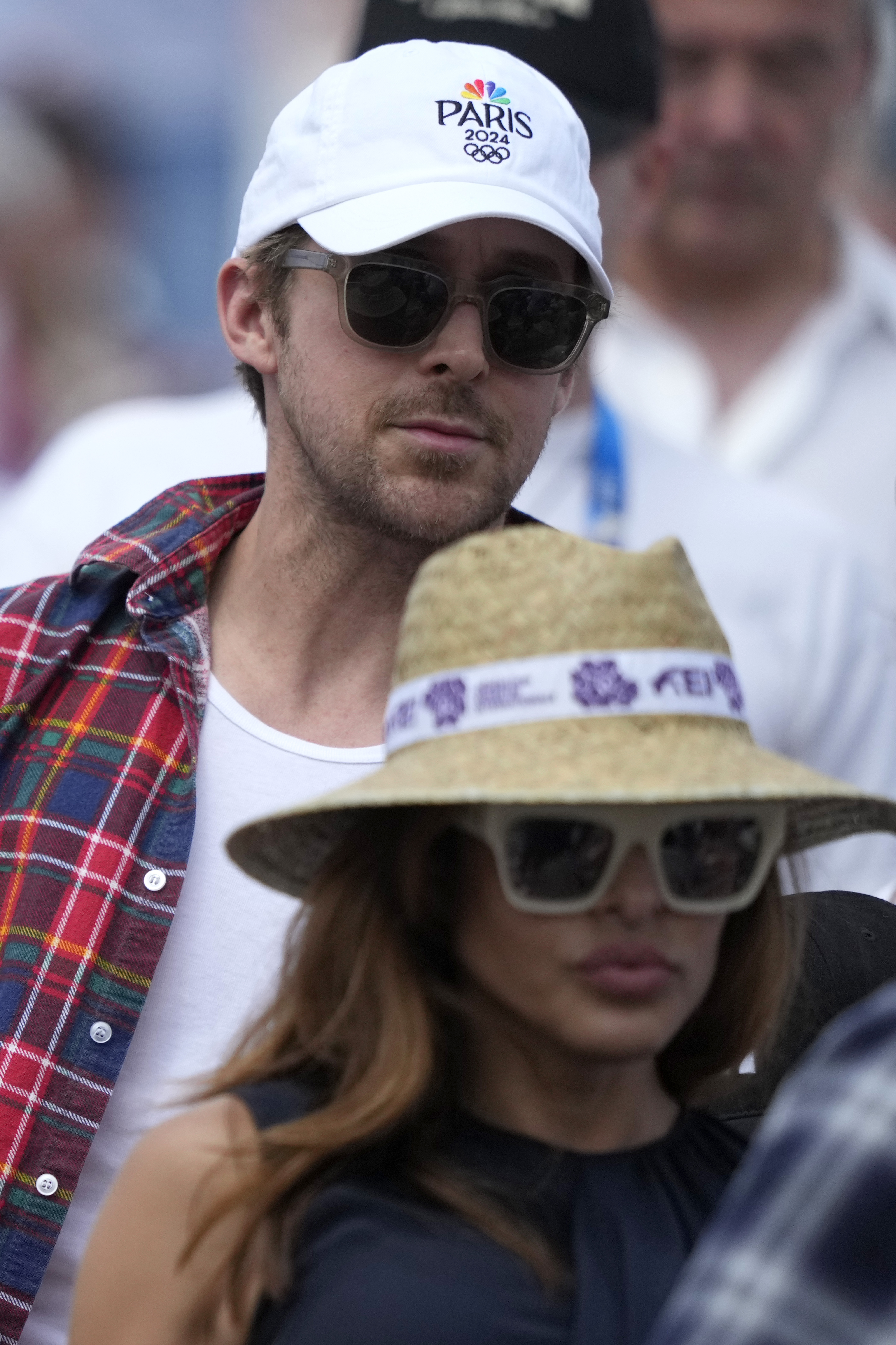 Ryan paired the hat with a colorful plaid button-up while Eva rocked a sleeveless black top