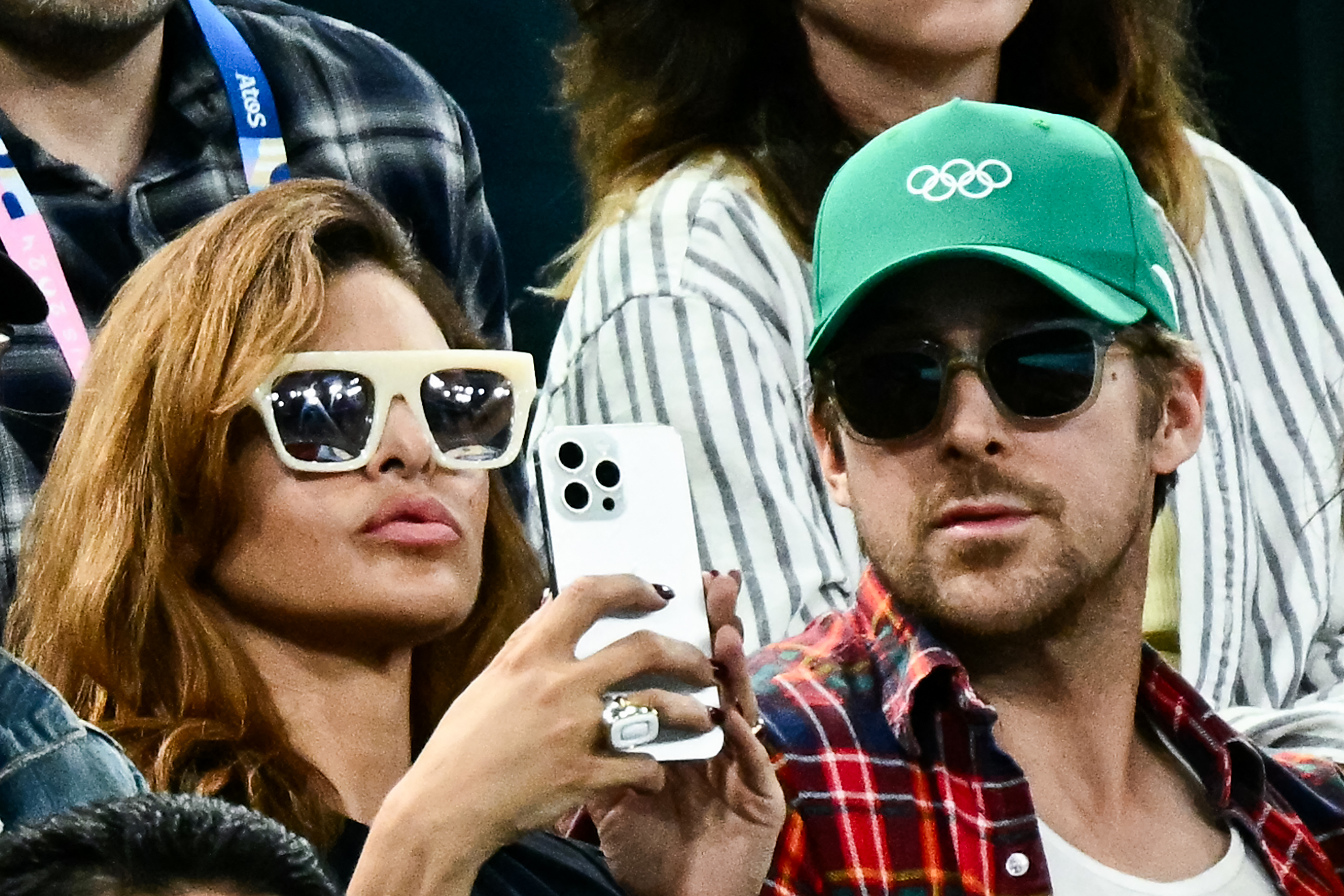 Ryan Gosling swapped his white hat for a green one while attending the gymnastics women’s uneven bars final