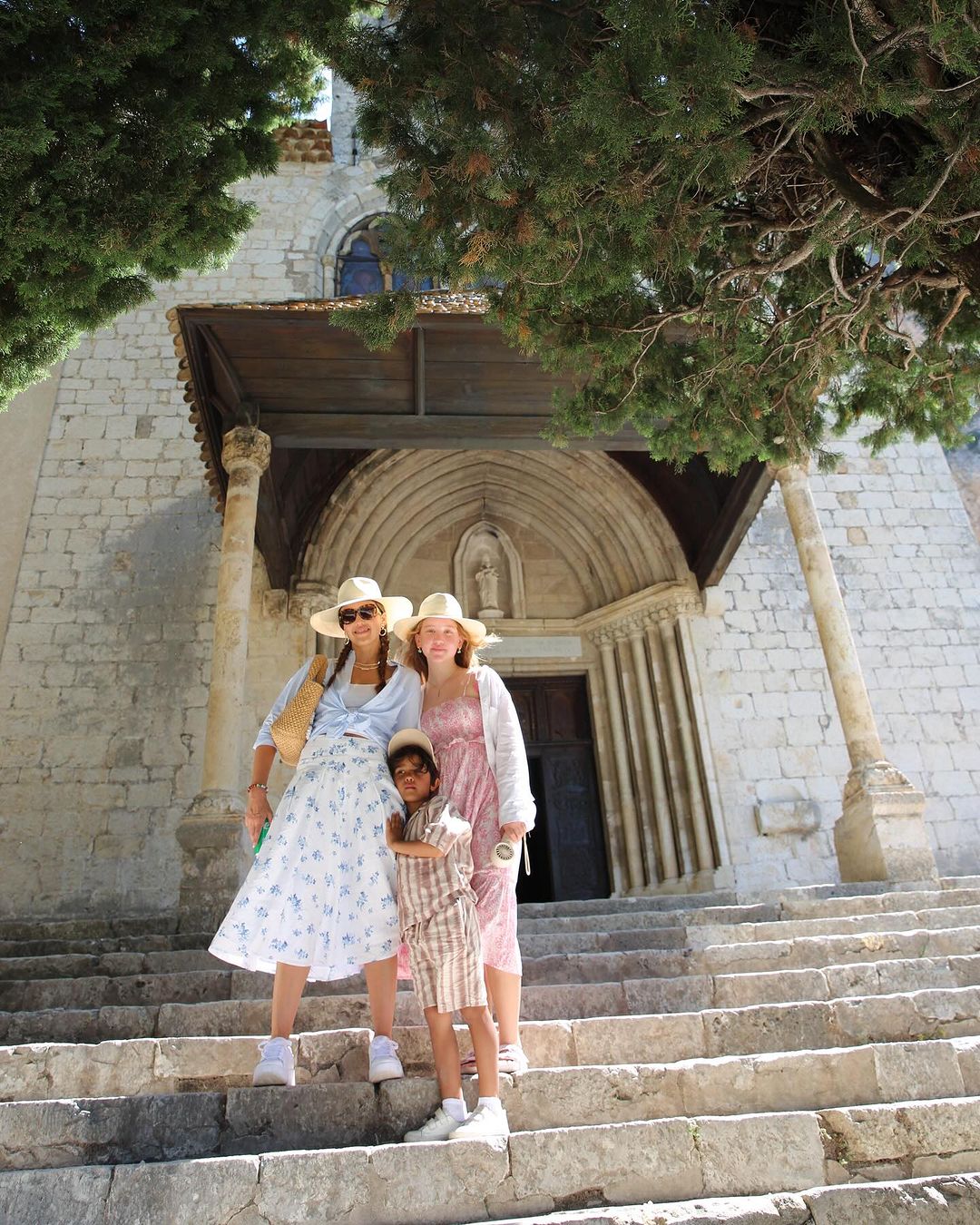 Jessica Alba with her daughter Haven and son Hayes on the steps of an old church
