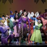 Sutton Foster, smudgy-faced and dressed in rags, backed by the Broadway cast of "Once Upon a Mattress."
