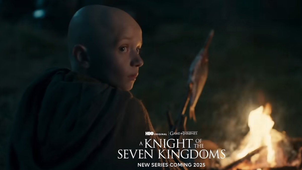 Bald Egg looks away from a fire where a bird cooks on a spit on A Knight of the Seven Kingdoms