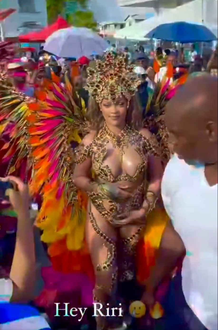 The musician stunning in a tiny gold outfit with pink, orange, and yellow accents during the event