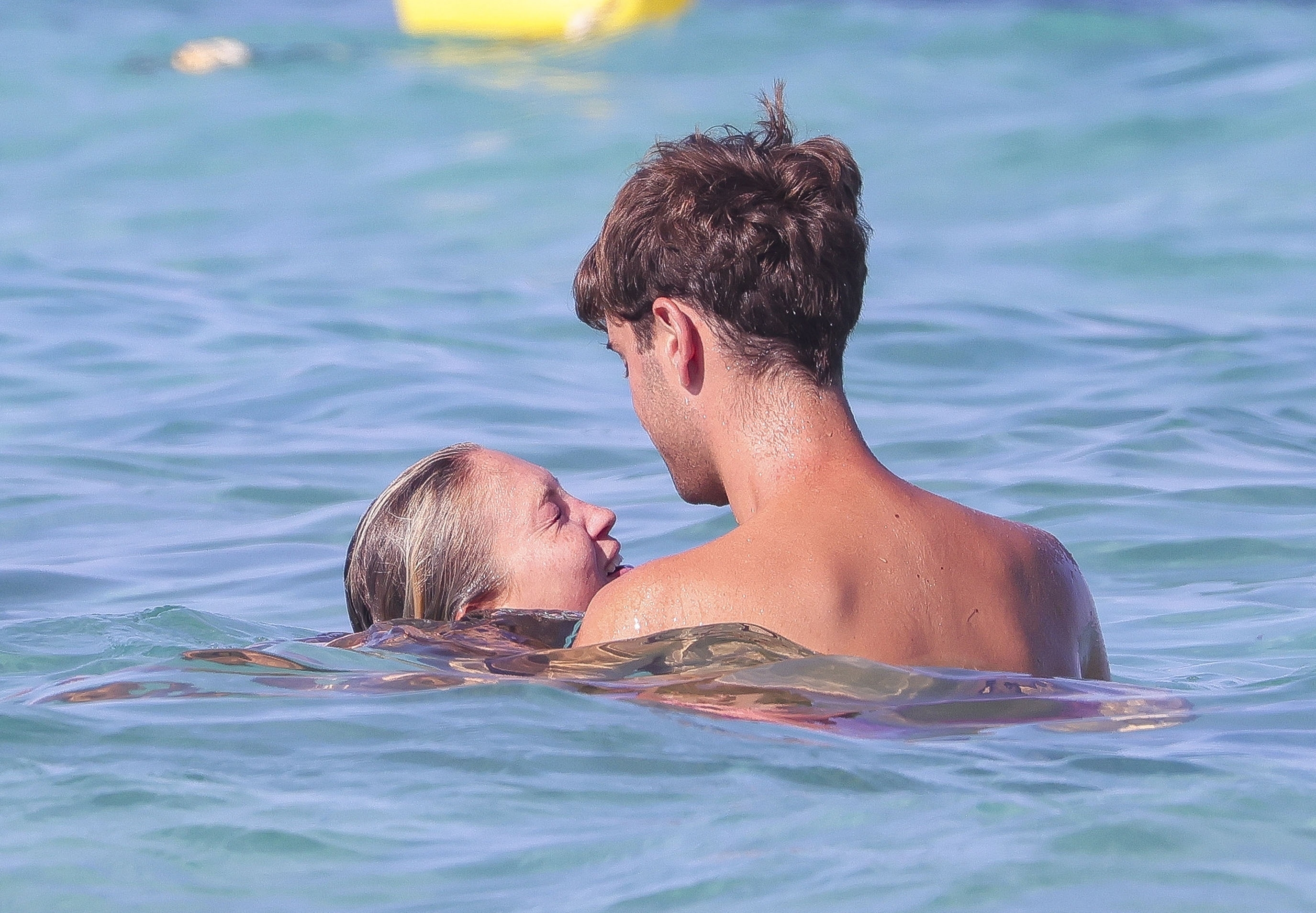 Lila looked completely loved up with her boyfriend as they played in the sea