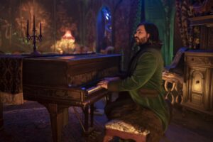 A man in a gothic house plays the piano in "What We Do in the Shadows."
