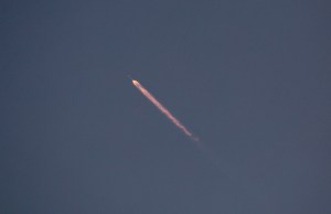 A SpaceX Falcon 9 rocket, loaded with Starlink communications satellites and launched from Vandenberg Space Force Base, heads for orbit on July 10, 2024, as viewed near Lompoc, California. With this flight, SpaceX suffered its first in-flight failure of a Falcon 9 rocket since 2015, leaving 20 Starlink satellites in a perilously low orbit.