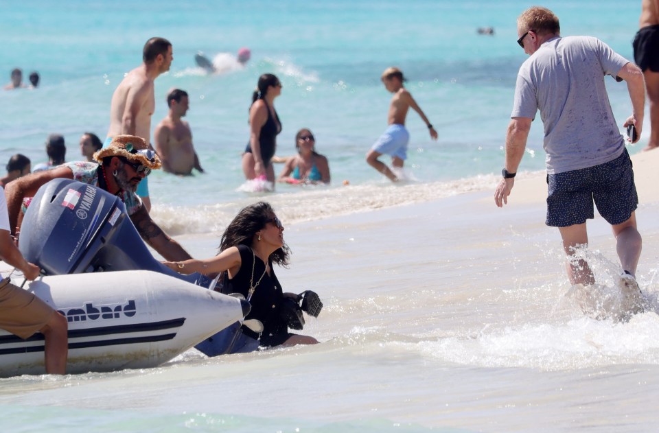 Salma sunk nearly waist-deep into the water and had to be assisted by the boat captain