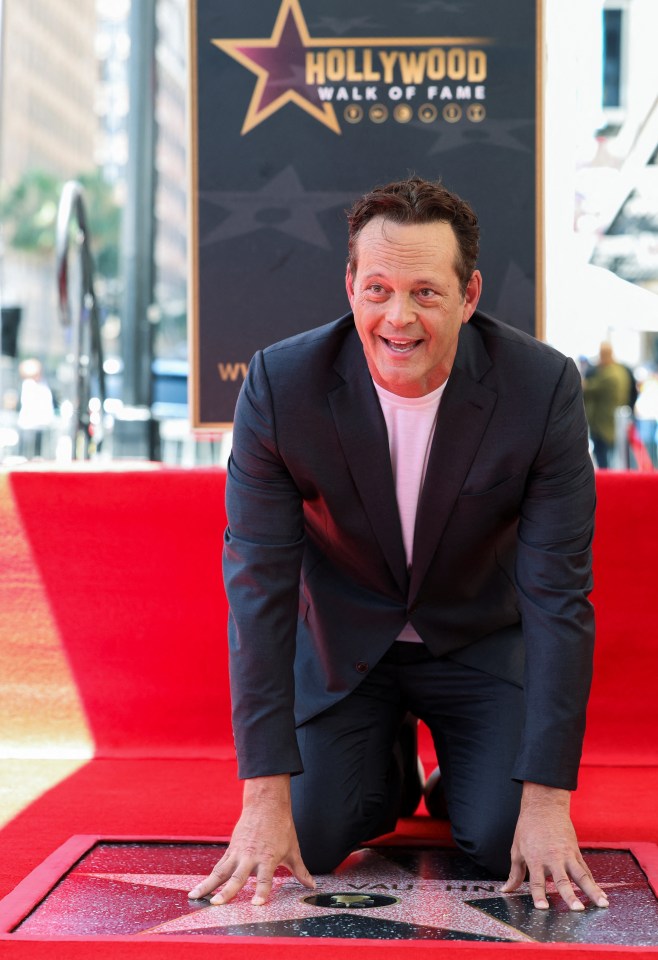 Dodgeball actor Vince Vaughn touching his new star on the Hollywood Walk of Fame