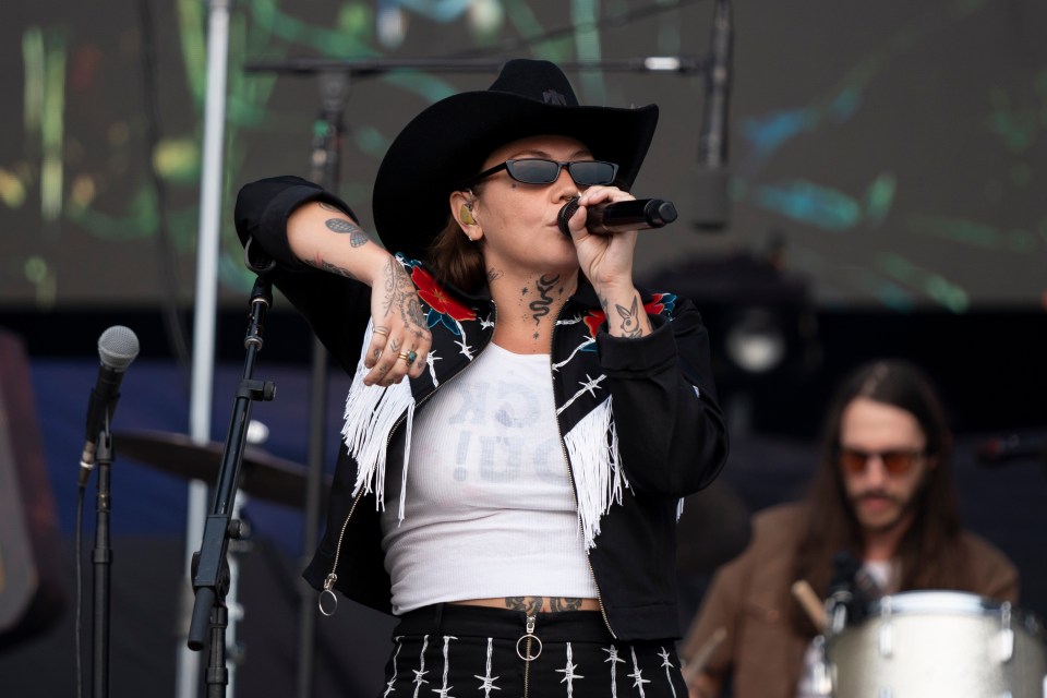 Elle King, seen on stage at Country Thunder Wisconsin in July 2024, addressed controversy over her drunken performance at Dolly Parton's birthday party