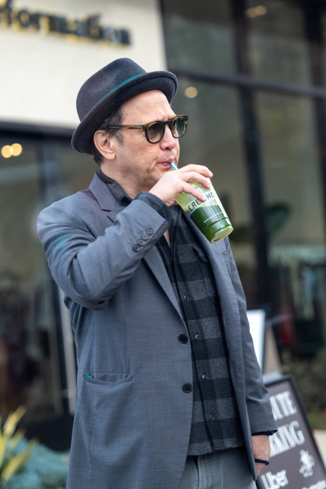 Elle King, daughter of Rob Schneider, seen drinking a green juice outside Erewhon in California, has said that she goes 'years' without speaking to her father