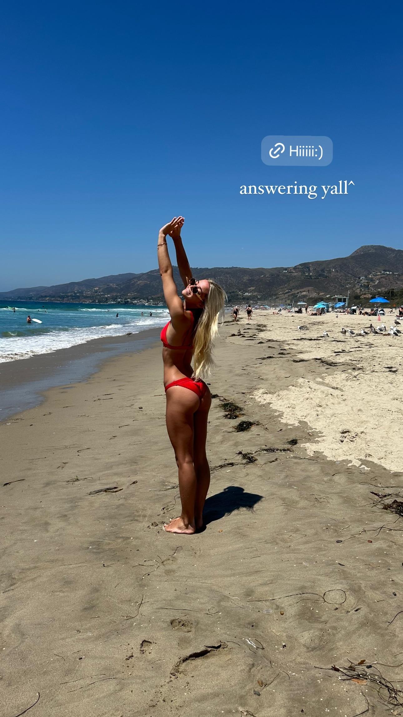 Olivia Dunne strikes a pose at the beach.