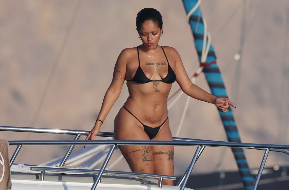 Khleopatre showing off her curves in a stringed bikini