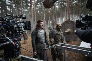 Adar and an orc in front of cameras in The Rings of Power season two