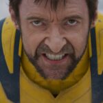 Hugh Jackman as Wolverine snarls into the camera in closeup in Deadpool & Wolverine