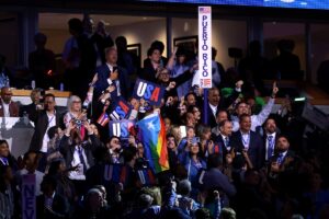 Members of the Puerto Rico delegation cast their votes during the Ceremonial Roll Call of States on the second day of the Democratic National Convention at the United Center on August 20, 2024 in Chicago, Illinois. Delegates, politicians, and Democratic Party supporters are gathering in Chicago, as current Vice President Kamala Harris is named her party's presidential nominee. The DNC takes place from August 19-22. (Photo by Joe Raedle/Getty Images)