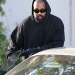 Kanye West wearing black hoodie