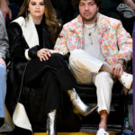 Selena Gomez and Benny Blanco attend a basketball game between the Los Angeles Lakers and the Miami Heat on January 03, 2024, in Los Angeles, California