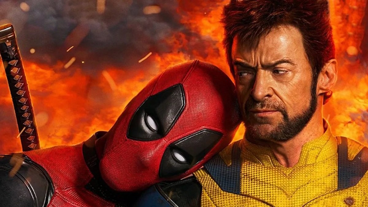 Deadpool puts his head on Wolverine's shoulder.