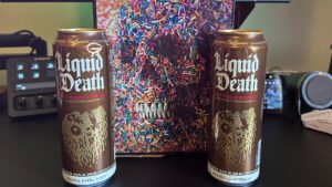 Liquid Death cans with art from the box