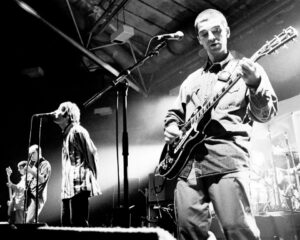 Oasis brothers Liam and Noel Gallagher performing live at the Sheffield Octagon Centre in 1994, at the height of the band's success