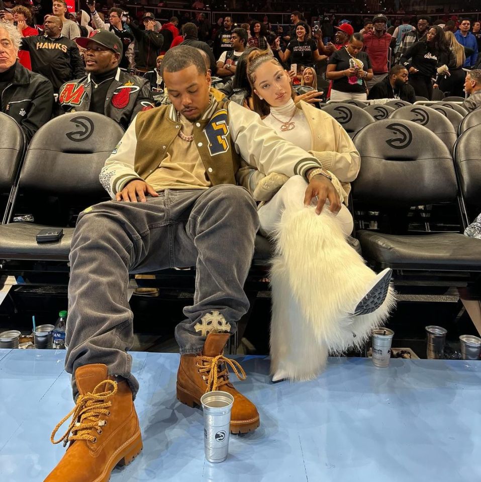 Bhad Bhabie sits courtside at a basketball game with her boyfriend Le Vaughn