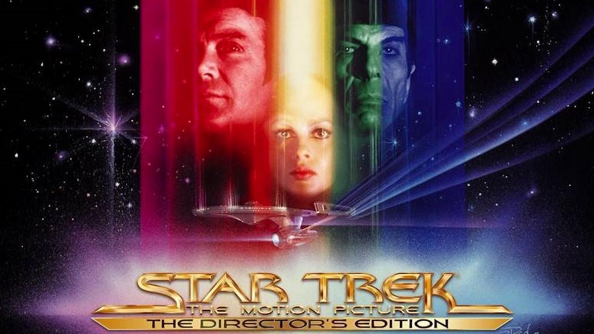 Star Trek The Motion Picture poster featuring three faces in red, yellow, and green light, and the Enterprise below them