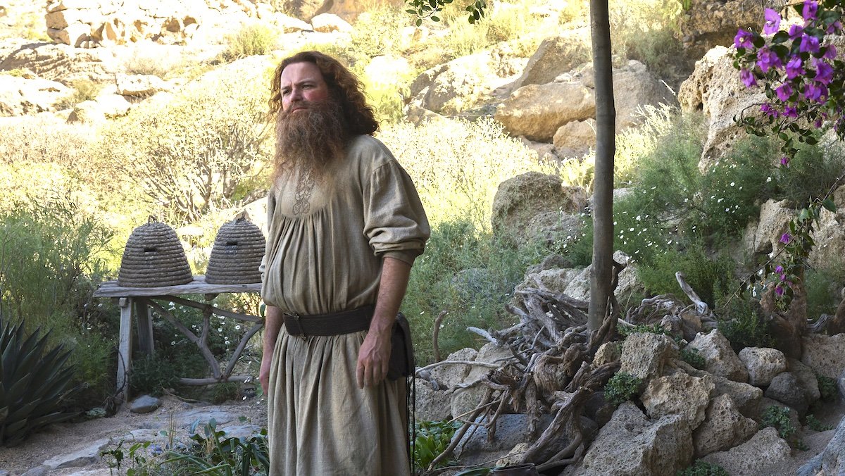 Rory Kinnear as Tom Bombadil standing outside on The Rings of Power