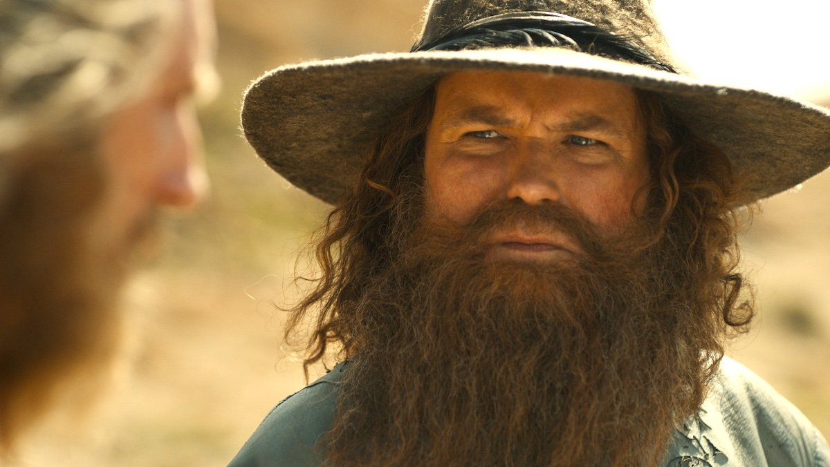 Rory Kinnear as Tom Bombadil with his beard and hat up close on The Rings of Power