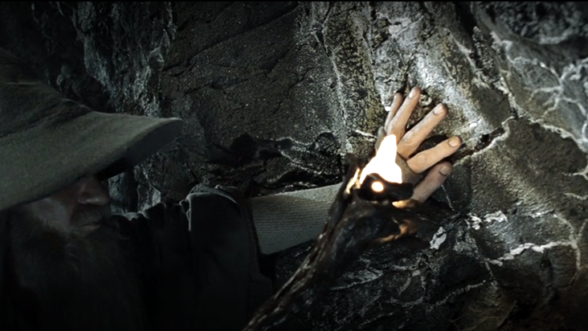 Gandalf lights his staff to reveal mithril veins in the walls of Moria in Fellowship of the Ring