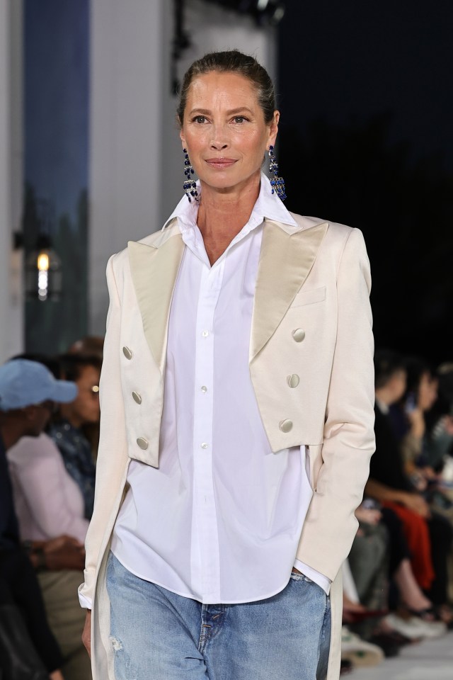 In another look, the Nineties supermodel was dressed in a cropped, tuxedo-style blazer, white shirt, and distressed, denim jeans