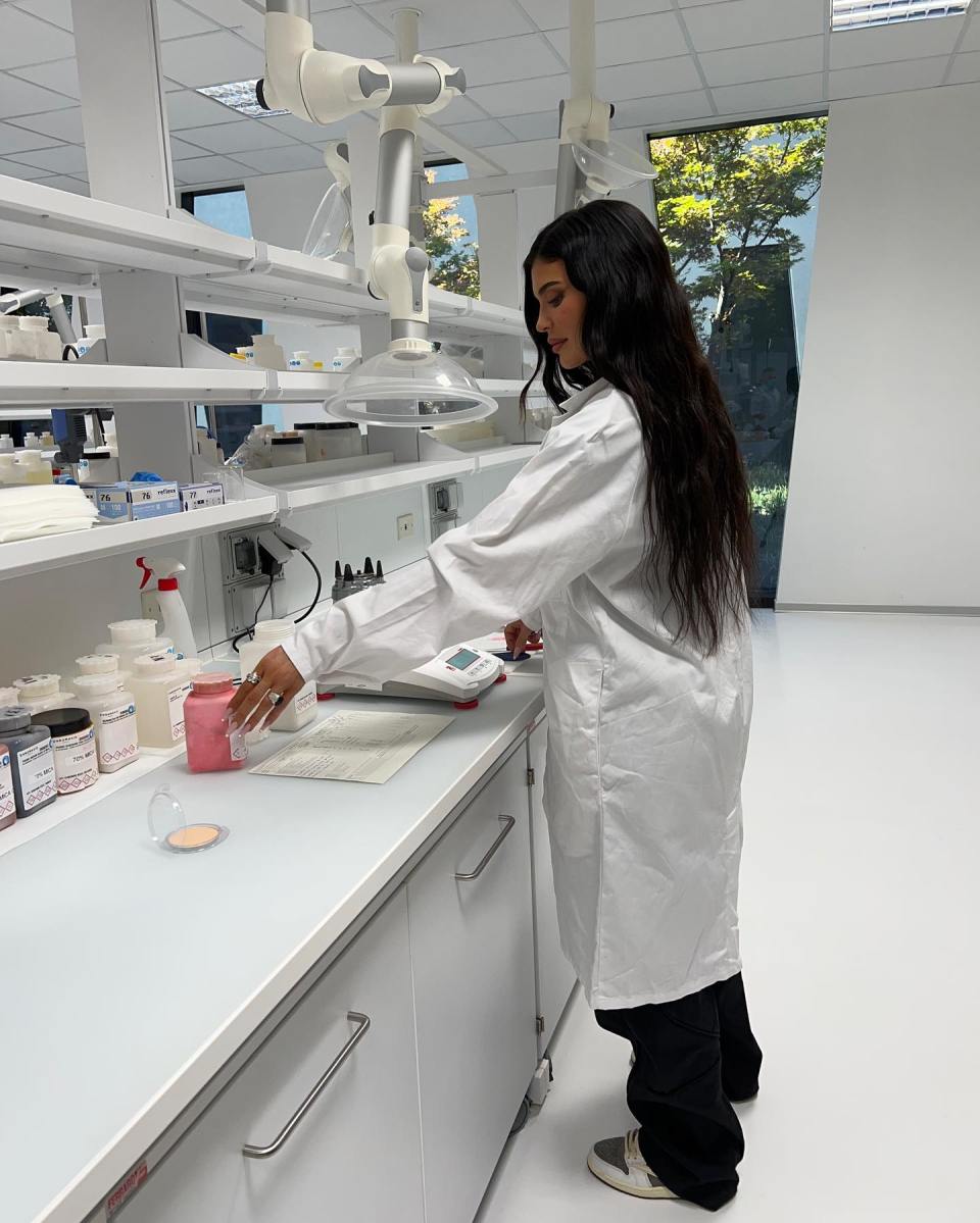 Kylie Jenner in a lab coat promoting Kylie Cosmetics