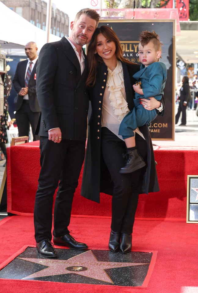 Macaulay Culkin, Brenda Song, and their son Dakota attend the ceremony honoring Macaulay with a Star on the Hollywood Walk of Fame in December 2023