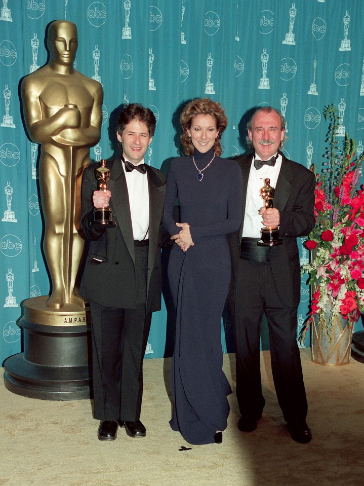 Composer James Horner, Celine Dion, and Will Jennings with their Oscars after they won Best Original Song