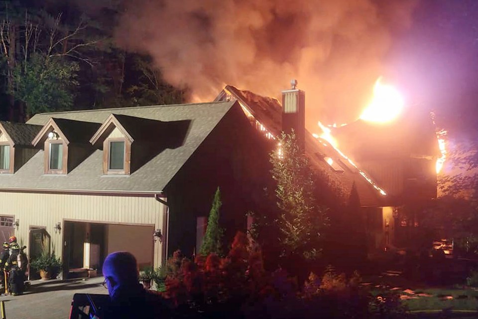 In this photo, a massive fire engulfs the home of cooking show star Rachael Ray, in Lake Luzerne, New York, on August 9, 2020