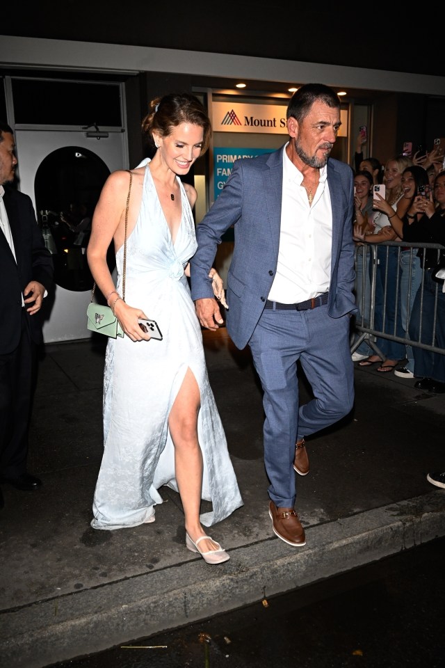 Lana Del Rey and Jeremy Dufrene are arm in arm while leaving a wedding in new York City on September 7