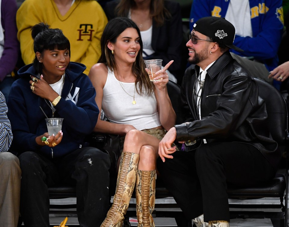 Kendall and Bad Bunny sitting courtside at the Los Angeles Lakers and Golden State Warriors game on May 12, 2023