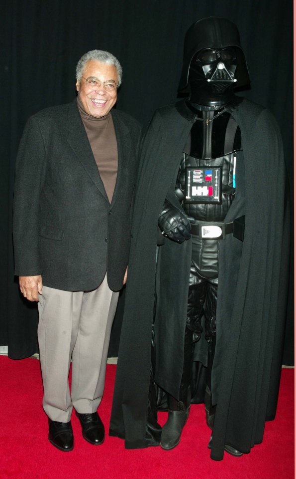 James Earl Jones poses alongside Darth Vader, the character he voiced in Star Wars