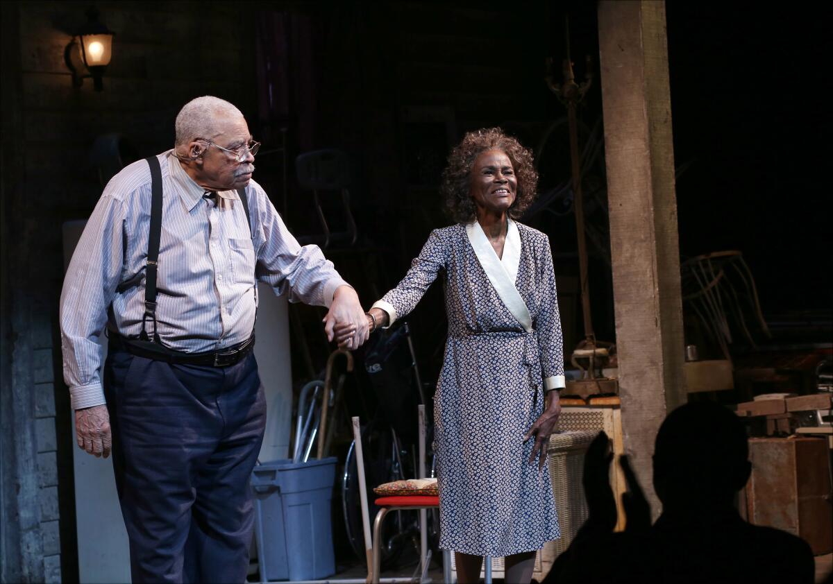 James Earl Jones and Cicely Tyson holding hands during a theater curtain call