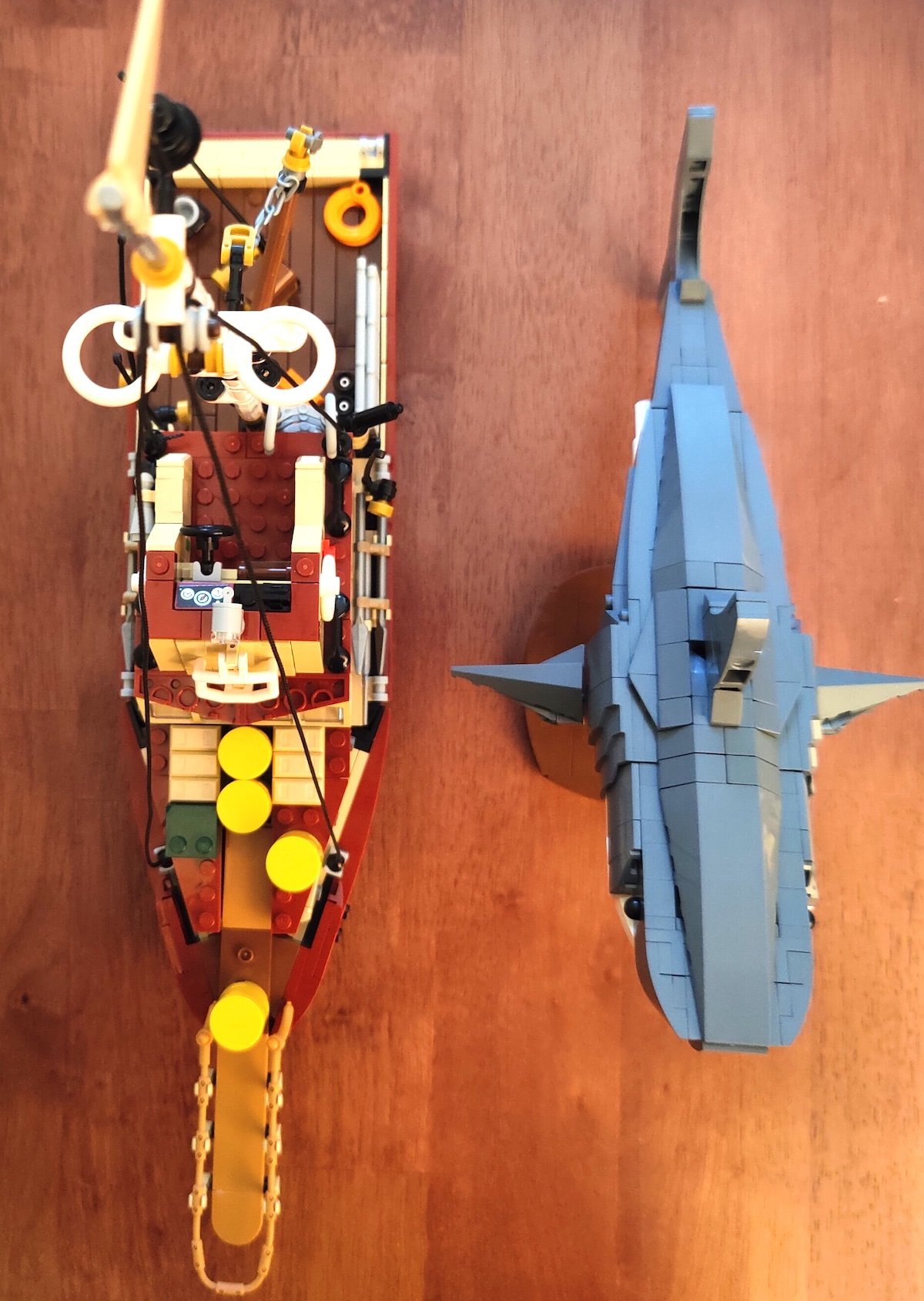 Overhead shot of the Orca chip next to the shark from the LEGO Jaws set