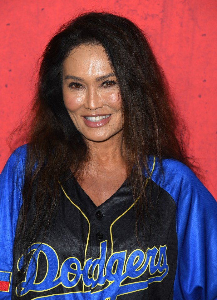 Tia wearing a Dodger's jersey at the premiere of The Killer's Game