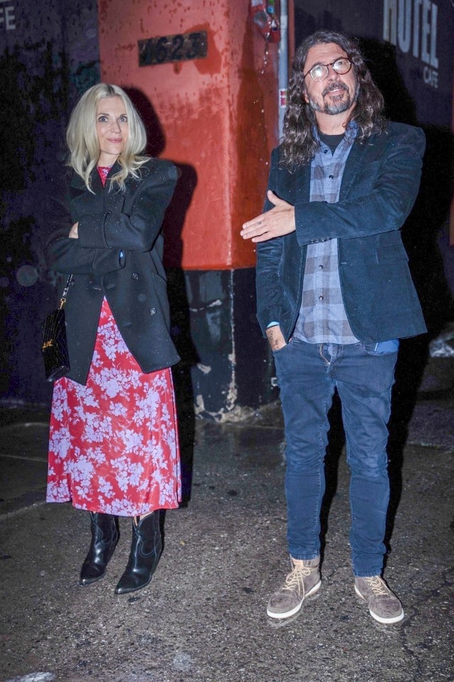 Dave Grohl and Jordyn Blum speaking to photographers outside a comedy club in Los Angeles, California