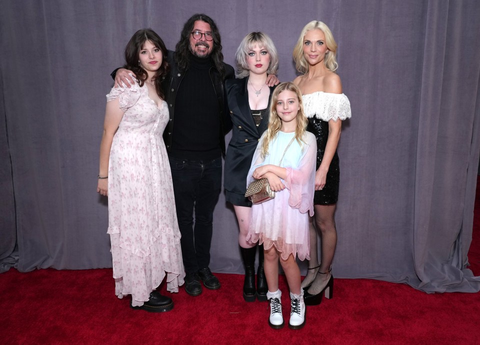 From left to right, Harper Grohl, Dave Grohl, Violet Grohl, Ophelia Grohl, and Jordyn Grohl at the 65th GRAMMY Awards on February 05, 2023 in Los Angeles, California.