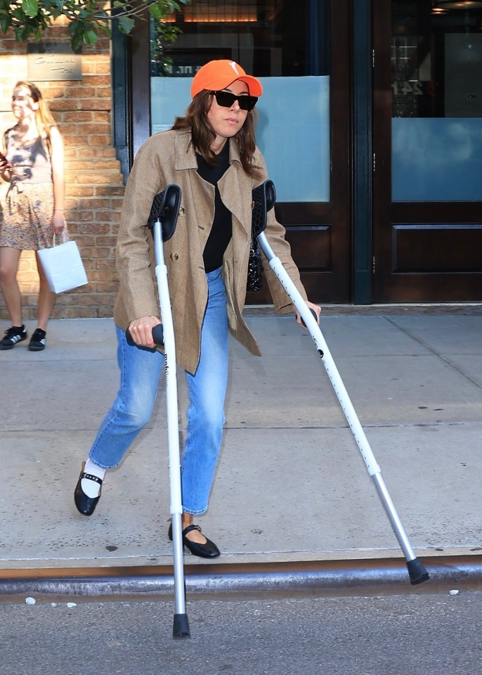 Aubrey Plaza on crutches while leaving The Greenwich Hotel in New York