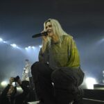 Female blond singer on stage a rock concert