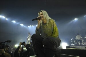 Female blond singer on stage a rock concert