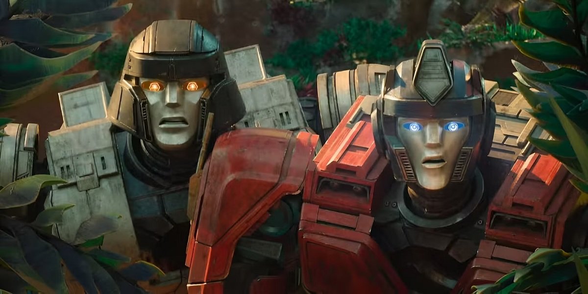 D-16 and Orion Pax look on in horror in Transformers One.