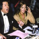 David McLane, left, and Jeanie Buss call a Women of Wrestling match in 2001.