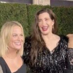 Parks & Rec's Adam Scott, Amy Poehler, Kathryn Hahn, and Aubrey Plaza smiling together on the red carpet of Agatha All Along