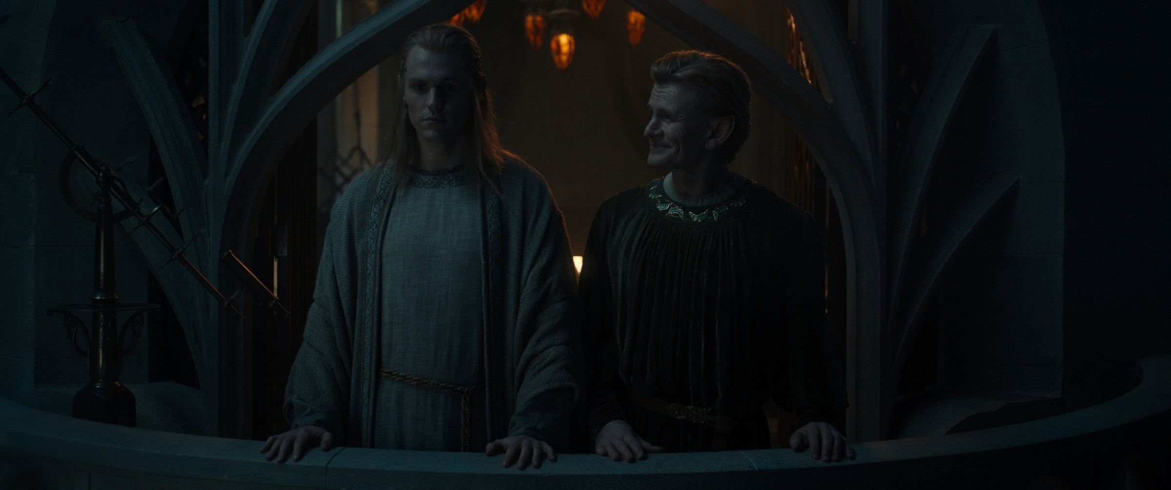 Charlie Vickers as Annatar and Charles Edwards as Celebrimbor standing on a balcony in Rings of Power 